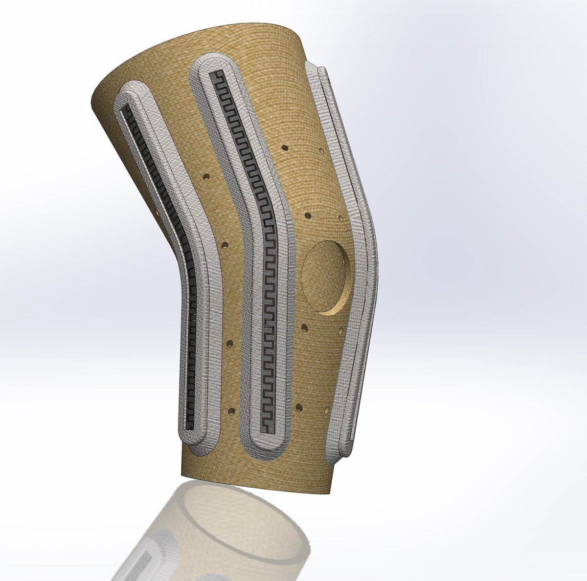 Engineering render of the SwaKnee knee applicator showing internal electromagnetic coil channels
