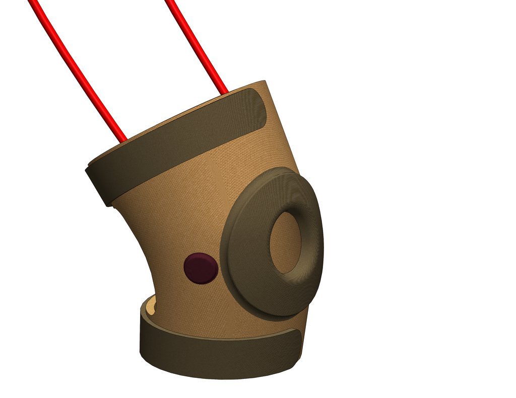 Engineering render of the SwaKnee applicator showing the embedded electromagnetic coil channels