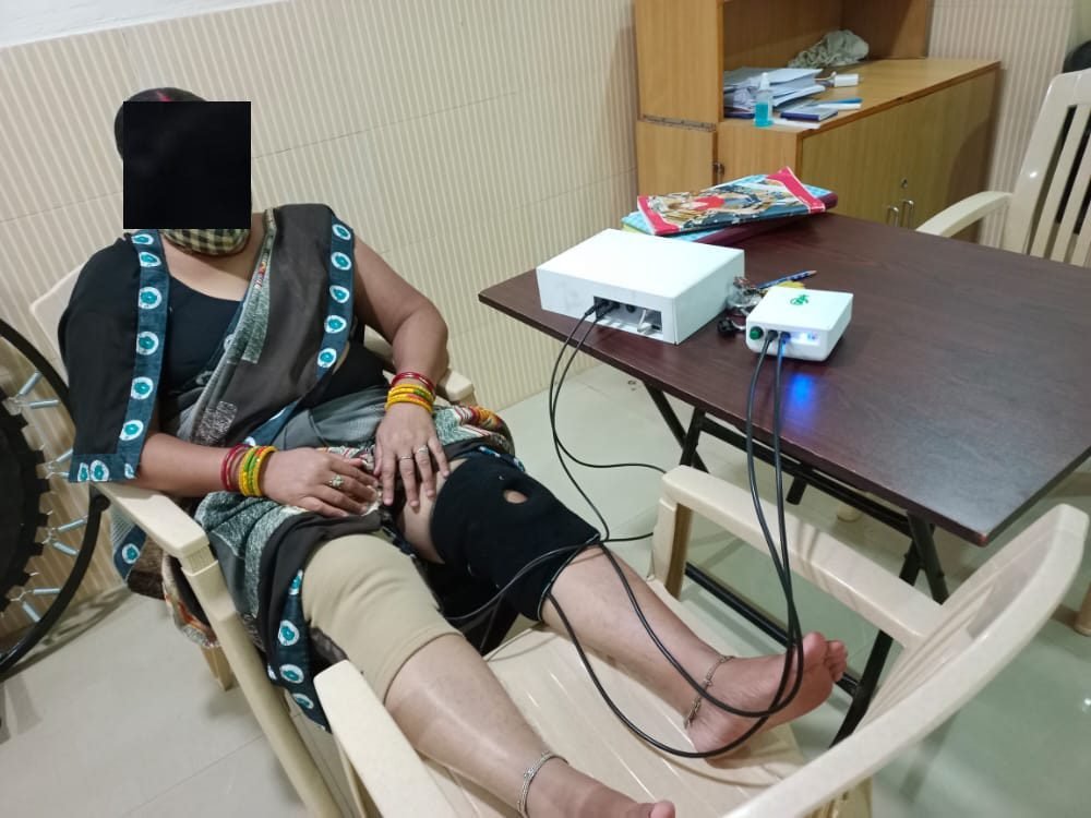 A participant using the SwaKnee device connected to the control module during a study session (identity obscured)